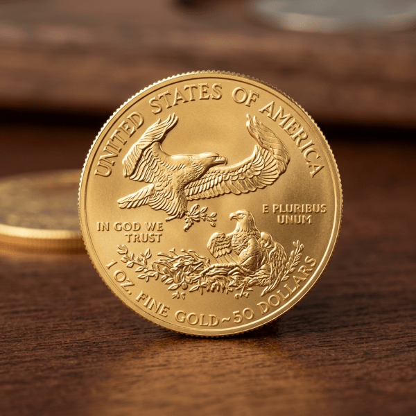 Gold coin with two eagles and inscriptions including United States of America, In God We Trust, E Pluribus Unum, 1 oz Fine Gold, 50 Dollars